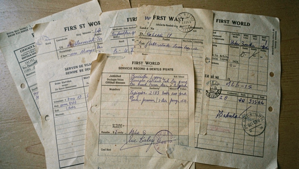 Several First World War service record forms with stamps, tables and handwritten entries